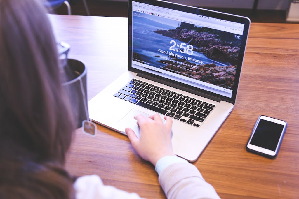 Person using a laptop with a browser open, ideal for remote work themes.